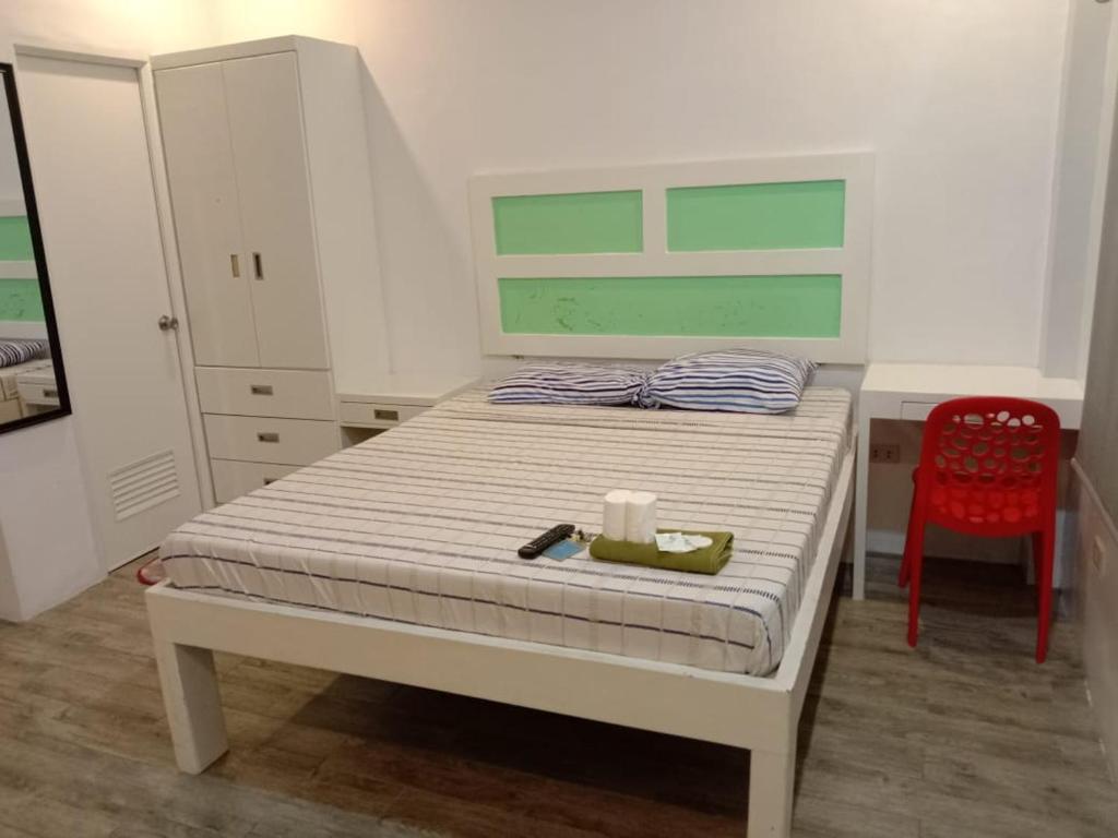 Postel nebo postele na pokoji v ubytování Enamorado Studios