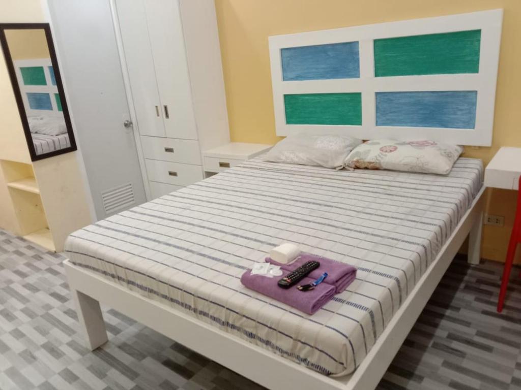 Postel nebo postele na pokoji v ubytování Enamorado Studios