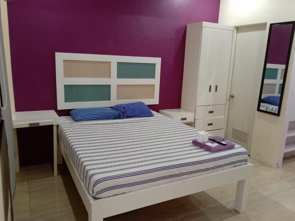 Postel nebo postele na pokoji v ubytování Enamorado Studios