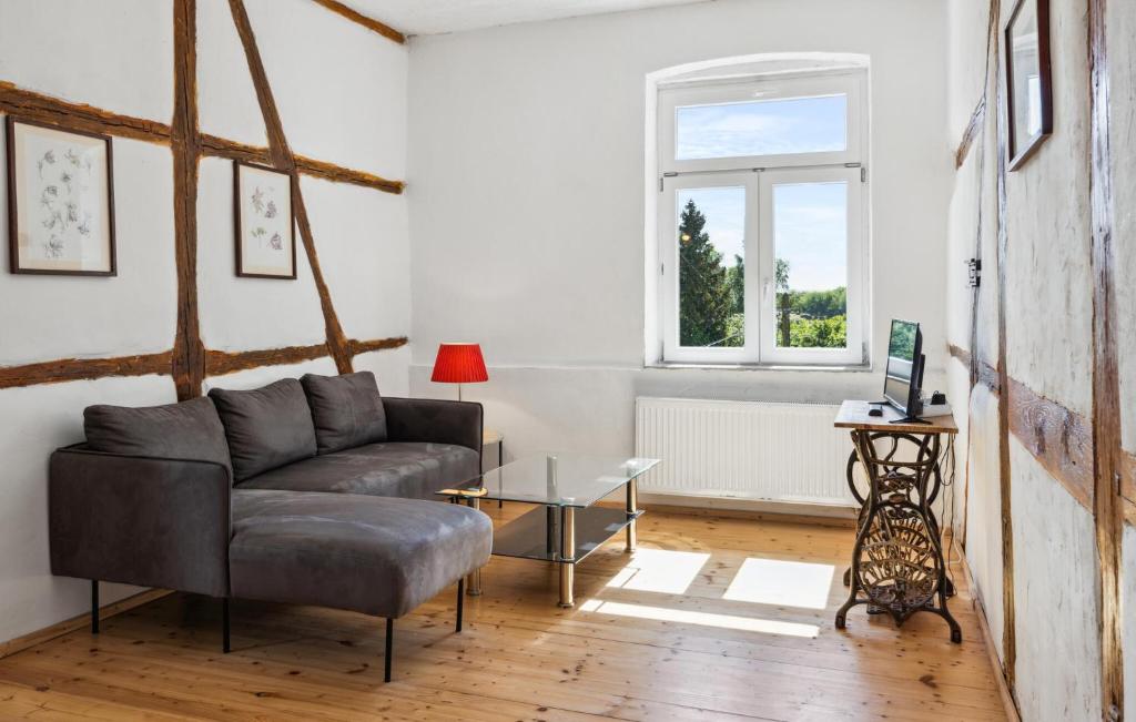 a living room with a couch and a table at Ferienwohnung Stefanie in Rambin