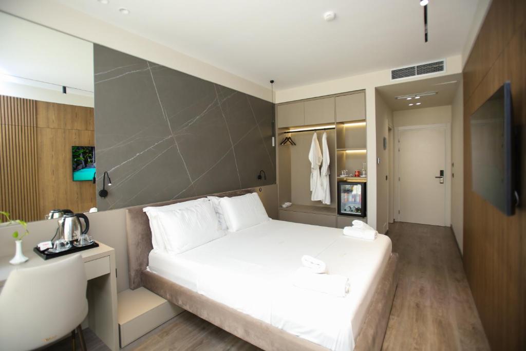 Postel nebo postele na pokoji v ubytování Charm Hotel