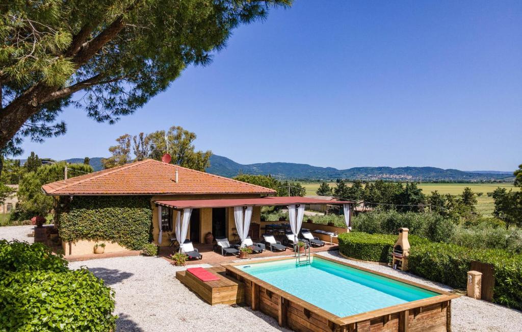 an outdoor pool with a gazebo and a house at Casa Bellavista in Casa Lappi