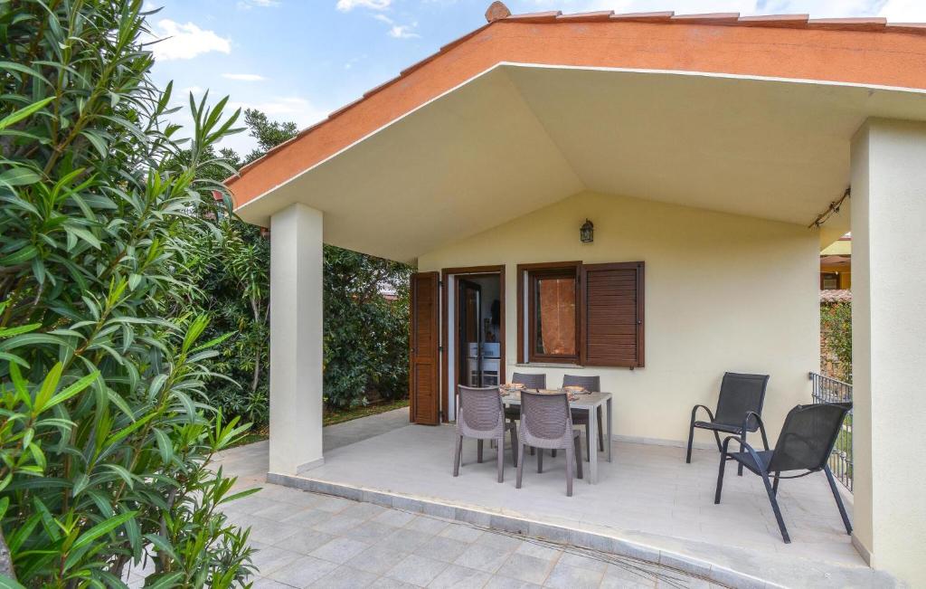 a patio with chairs and a table in a house at Secca 3 in Costa Rei