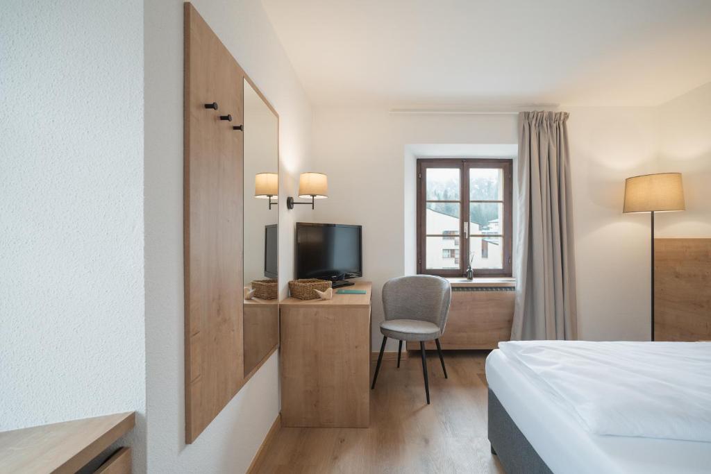 Postel nebo postele na pokoji v ubytování Hotel Brocco & Posta