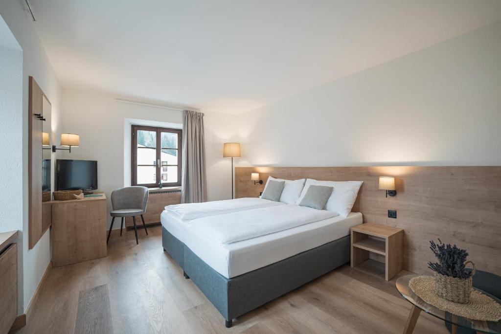 Postel nebo postele na pokoji v ubytování Hotel Brocco & Posta