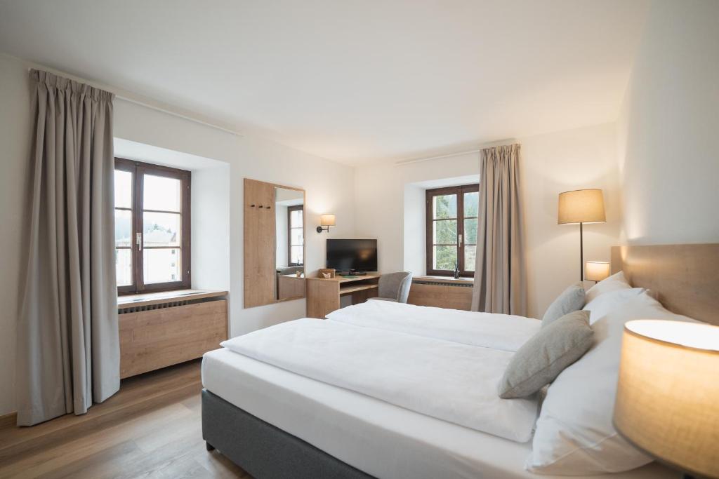 Postel nebo postele na pokoji v ubytování Hotel Brocco & Posta