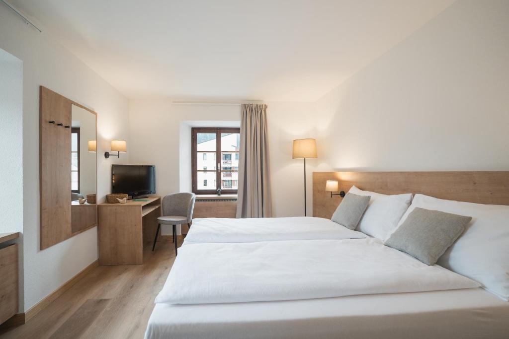 Postel nebo postele na pokoji v ubytování Hotel Brocco & Posta