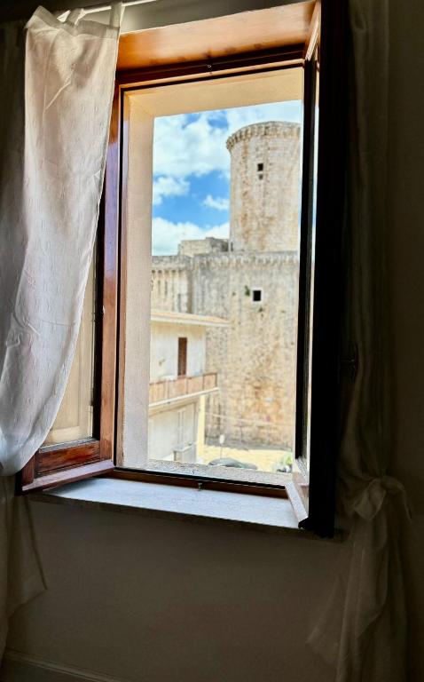 a window with a view of a castle at Amas Apartment in Fondi