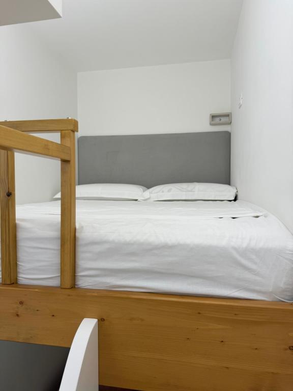 Postel nebo postele na pokoji v ubytování Guest Room Angolo Toscano