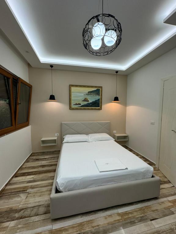 Postel nebo postele na pokoji v ubytování Guest Room Angolo Toscano
