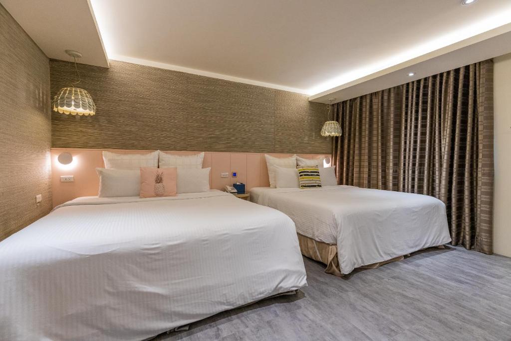 Postel nebo postele na pokoji v ubytování 里萊行旅 - Lilai Motel