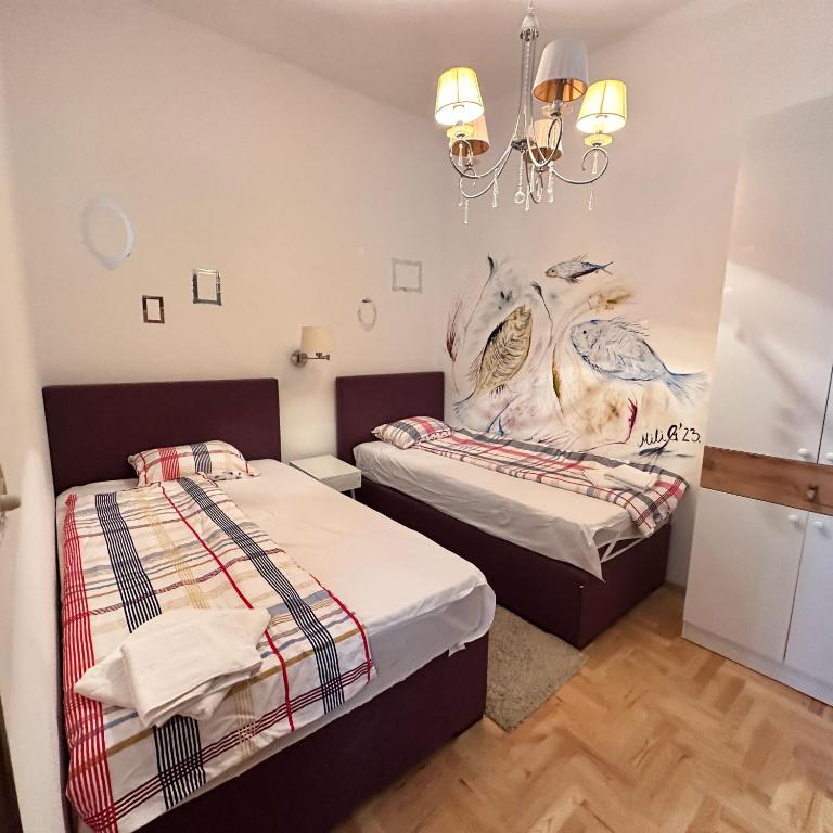 Postel nebo postele na pokoji v ubytování Apartments Lungo Mare
