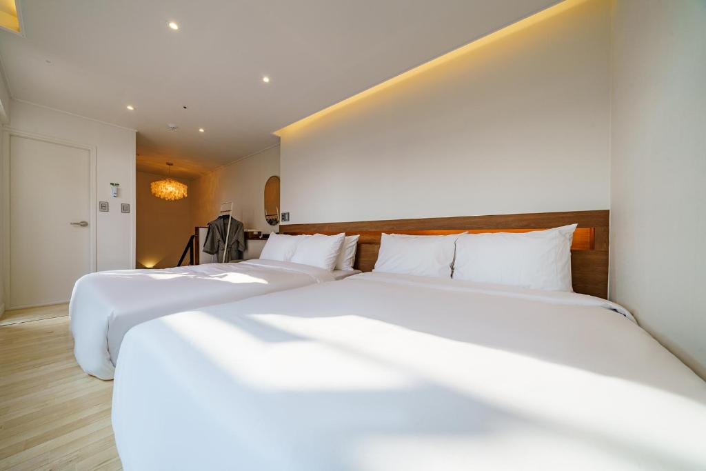 Postel nebo postele na pokoji v ubytování Hotel Haedeun