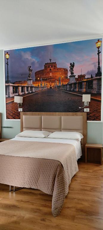 a bedroom with a large bed with a painting on the wall at Titta & Ruffo in Pisa