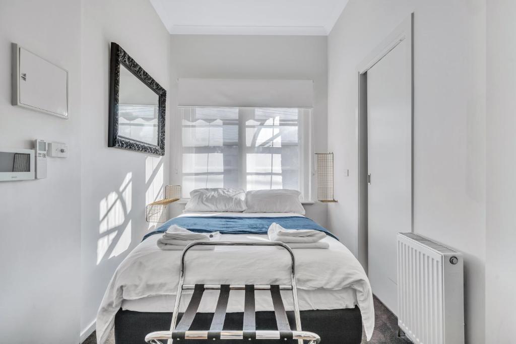 Postel nebo postele na pokoji v ubytování Grosvenor 3121 Richmond
