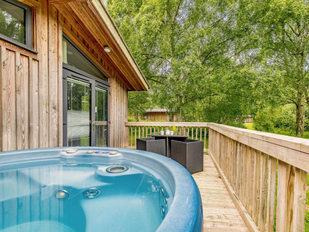 a hot tub on the deck of a house at 2 bed in Sherwood Forest 88428 