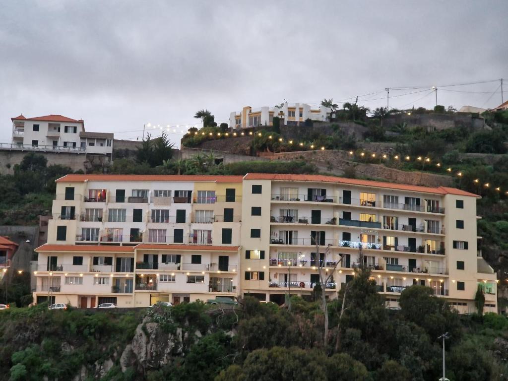 a large apartment building on top of a hill at Ina's Garden in Santa Cruz in Santa Cruz