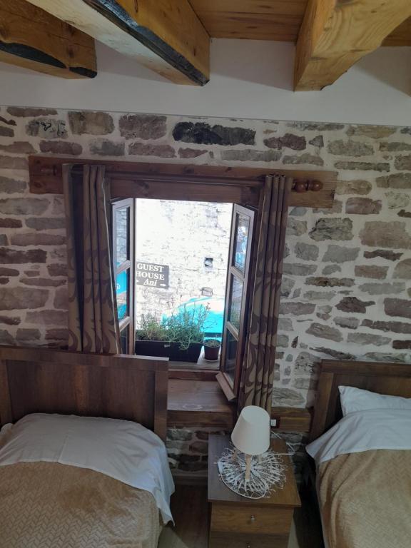 Postel nebo postele na pokoji v ubytování Guest House Ani