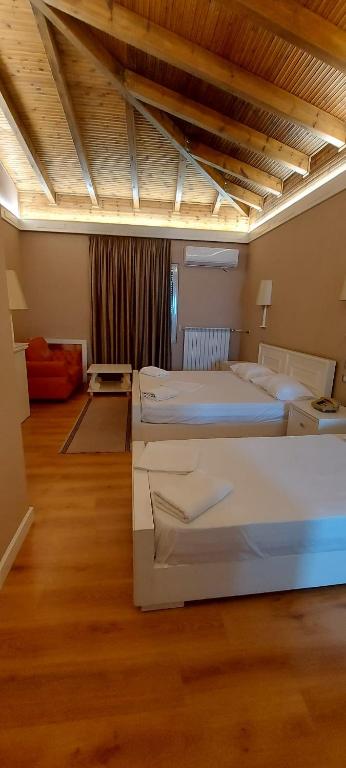 Postel nebo postele na pokoji v ubytování Hotel SHahini