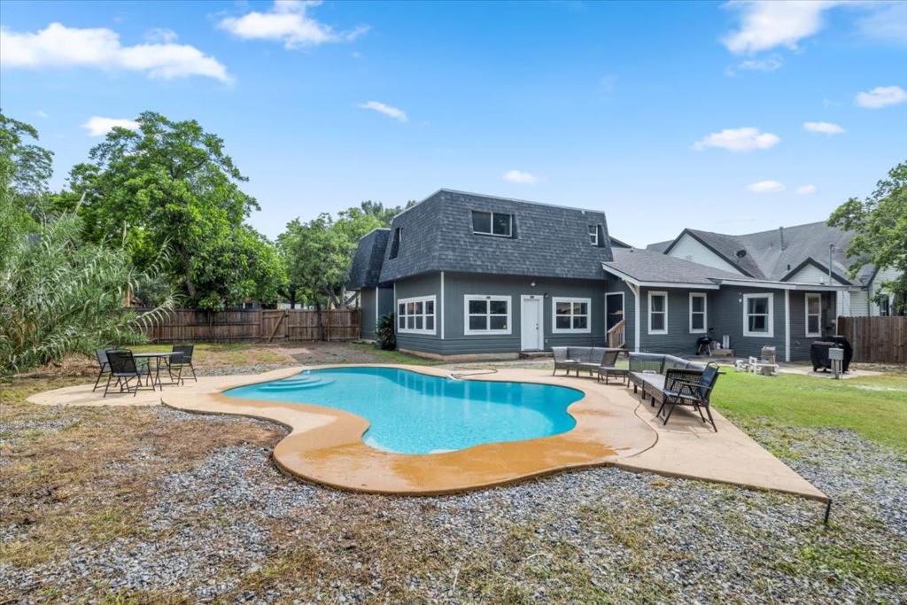 a backyard with a swimming pool and a house at Oasis in San Antonio - Awesome Pool in San Antonio