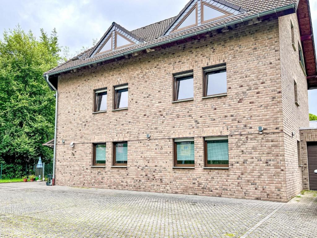 a brick building with windows on the side of it at Apartment Ferienapartments Adenau-4 by Interhome in Adenau