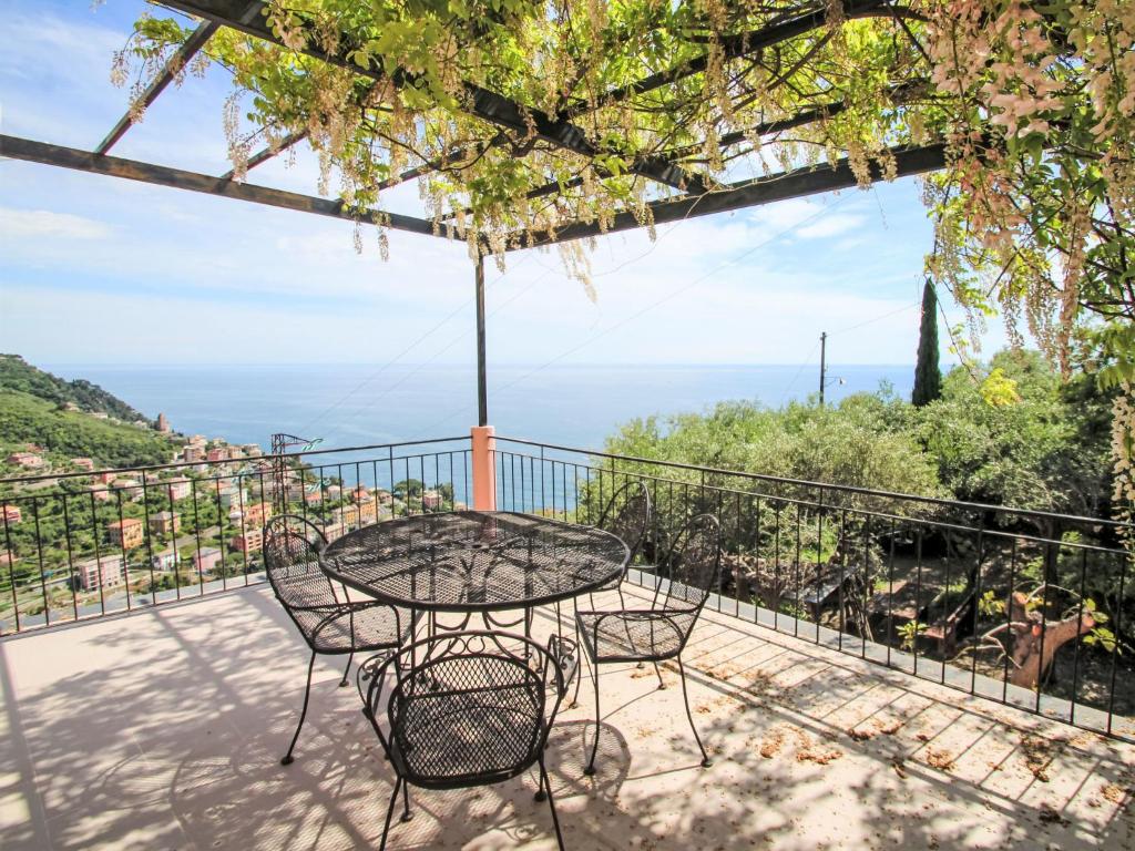 a patio with a table and chairs on a balcony at Holiday Home Italo by Interhome in Zoagli