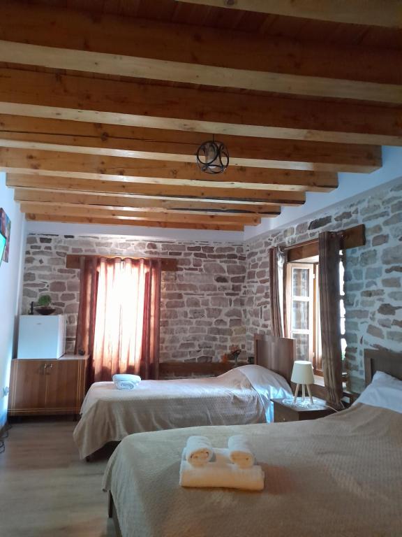 Postel nebo postele na pokoji v ubytování Guest House Ani