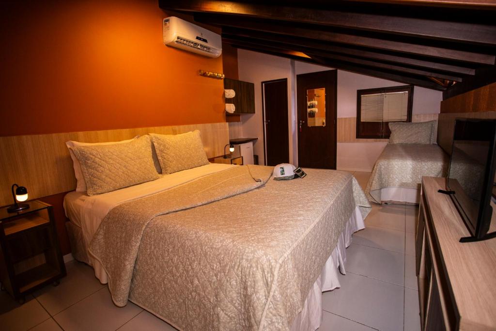 Lova arba lovos apgyvendinimo įstaigoje Casa Conceição