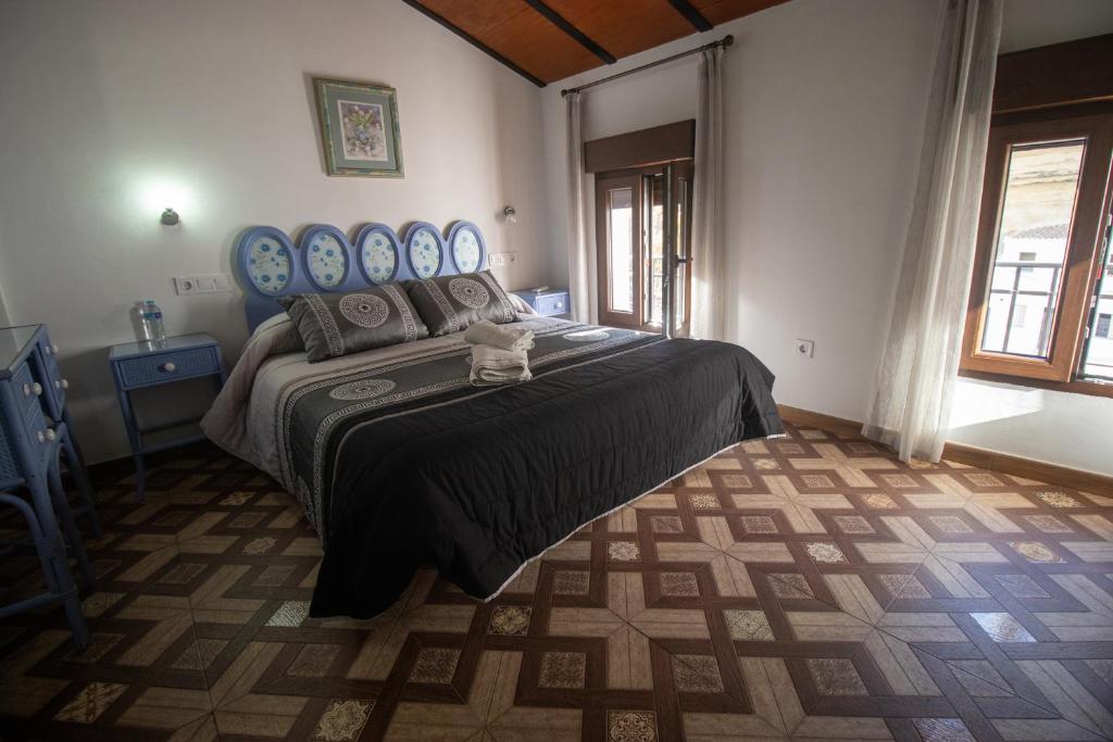 Łóżko lub łóżka w pokoju w obiekcie Casa Aveda ( En la Roca)