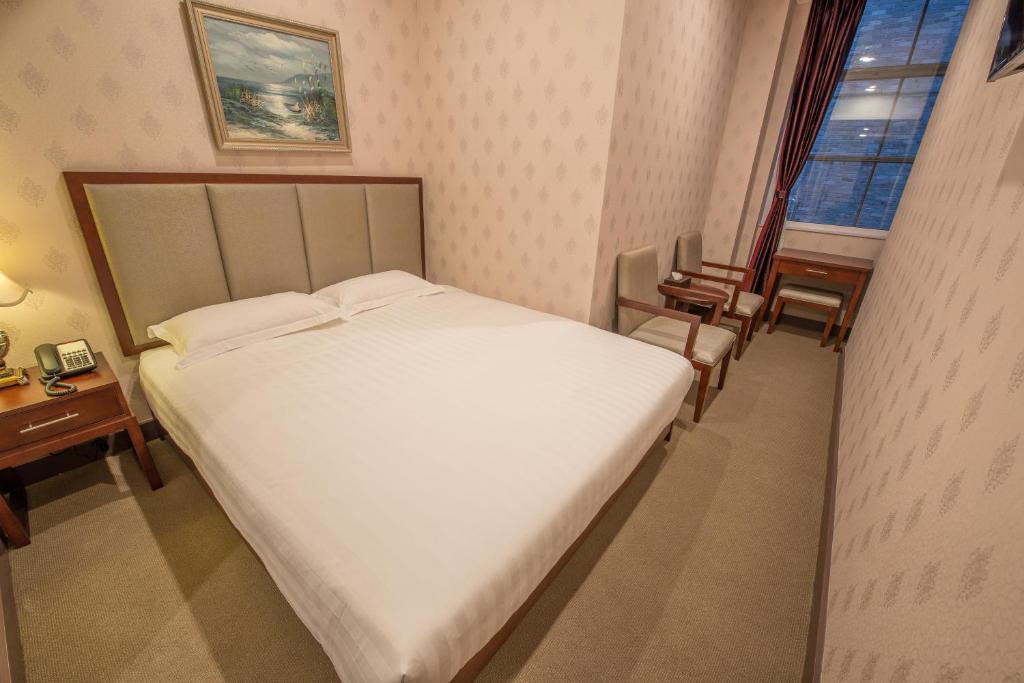 Postel nebo postele na pokoji v ubytování Megaboom City Hotel