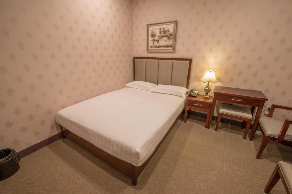 Postel nebo postele na pokoji v ubytování Megaboom City Hotel