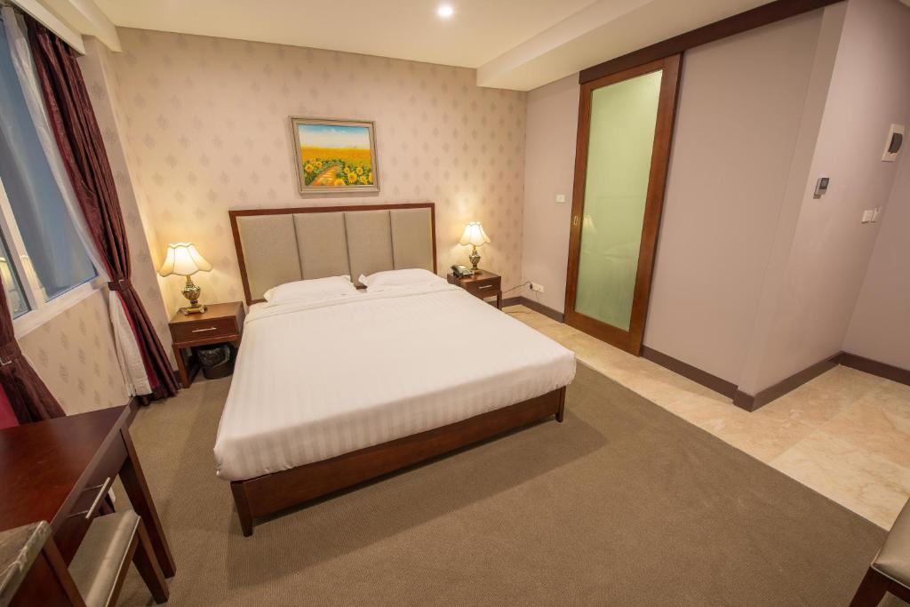 Postel nebo postele na pokoji v ubytování Megaboom City Hotel