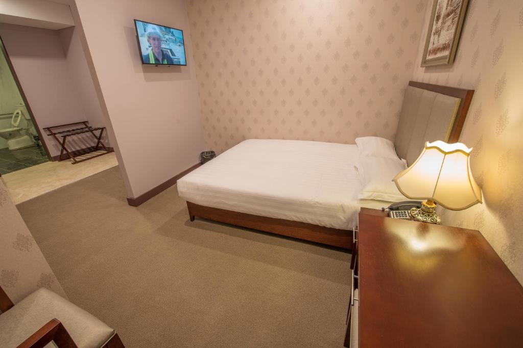 Postel nebo postele na pokoji v ubytování Megaboom City Hotel
