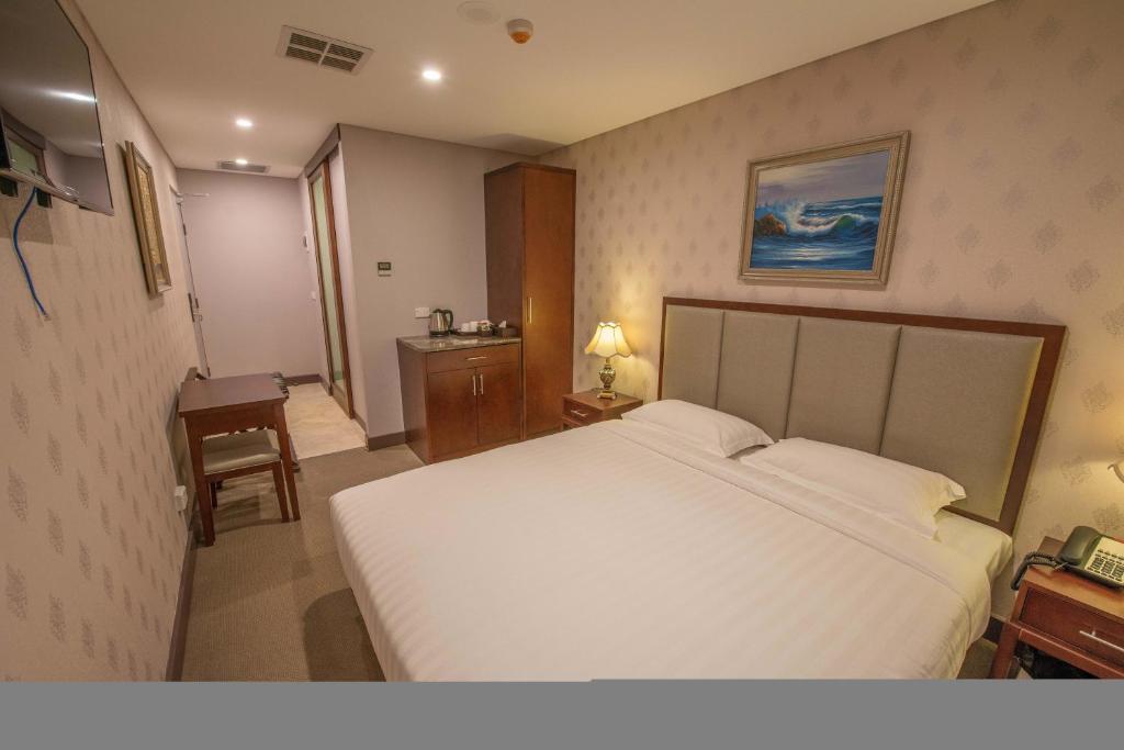 Postel nebo postele na pokoji v ubytování Megaboom City Hotel