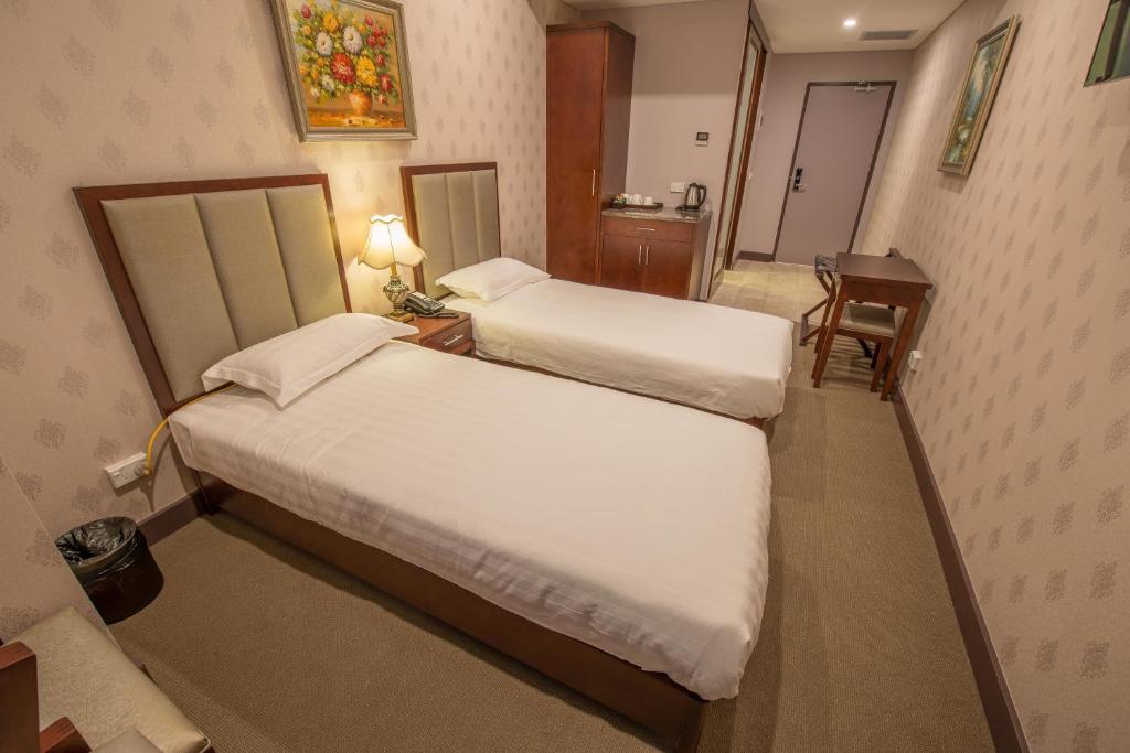 Postel nebo postele na pokoji v ubytování Megaboom City Hotel