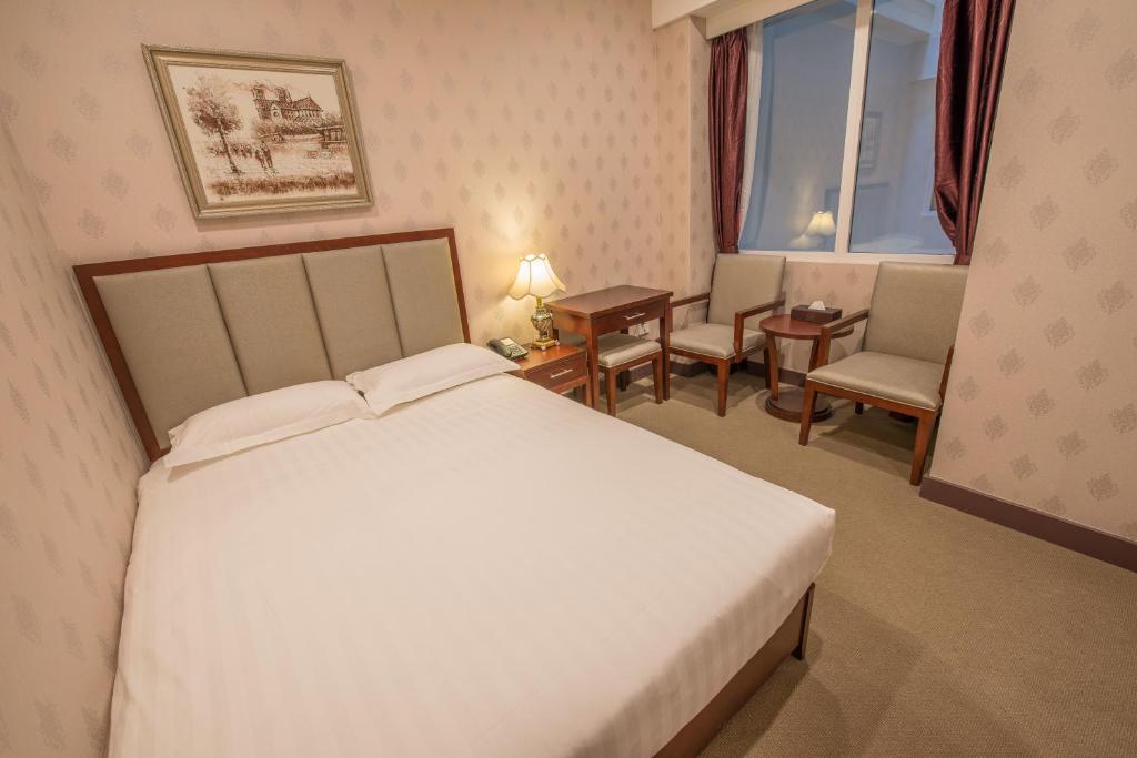 Postel nebo postele na pokoji v ubytování Megaboom City Hotel