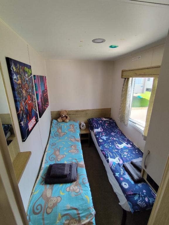 Postel nebo postele na pokoji v ubytování G & M Static Caravan Edinburgh