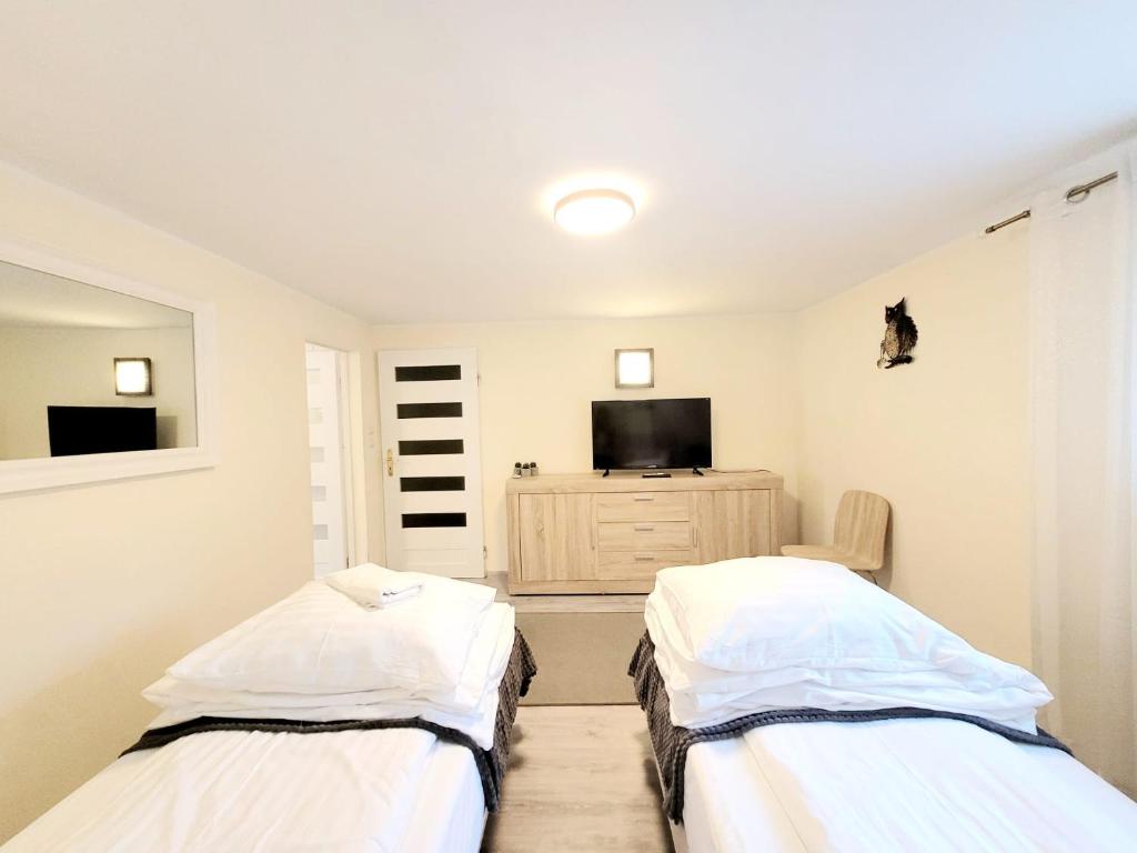 Posteľ alebo postele v izbe v ubytovaní Apartamenty Cudowna Wyspa