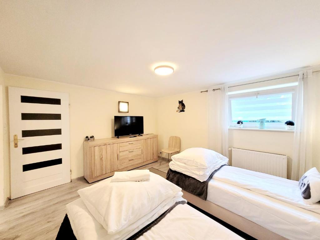 Posteľ alebo postele v izbe v ubytovaní Apartamenty Cudowna Wyspa
