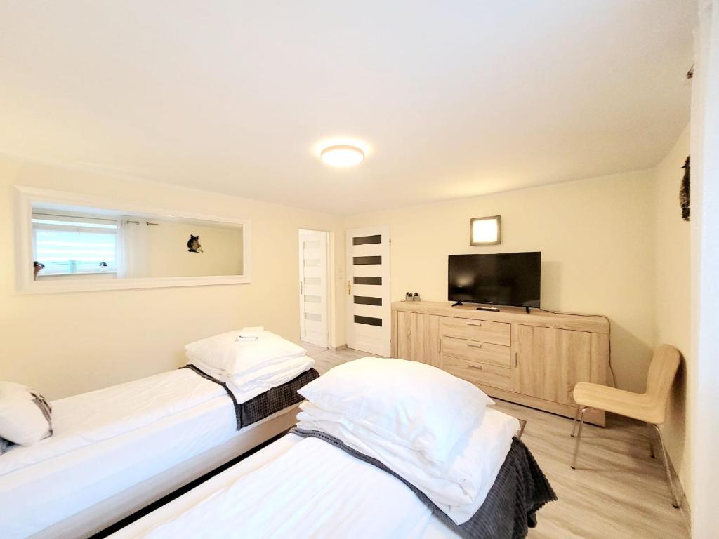 Posteľ alebo postele v izbe v ubytovaní Apartamenty Cudowna Wyspa