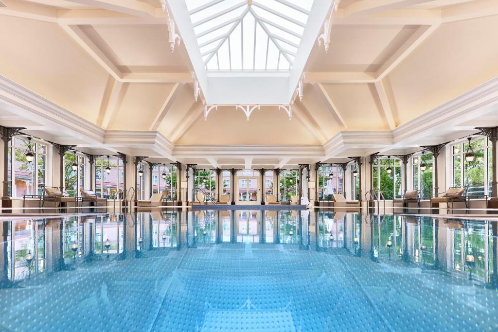 a swimming pool in a building with windows at Disneyland® Hotel in Chessy