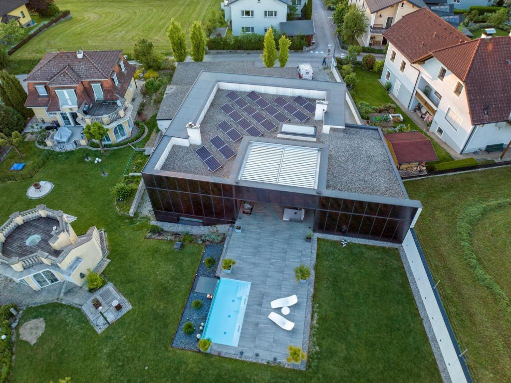 an overhead view of a house with a swimming pool at Apartment SunBox in Schwertberg