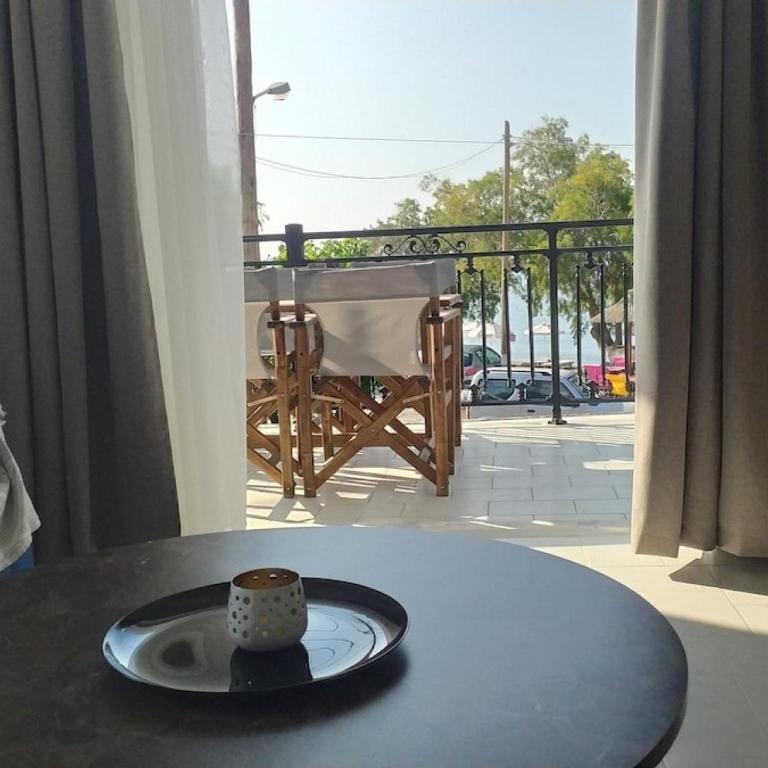 a table with a cup on top of a table at Samos Home by the sea in Kámpos