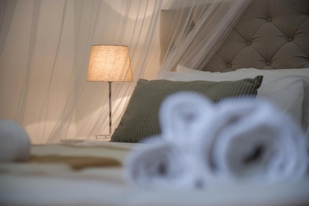 Postel nebo postele na pokoji v ubytování Residenza Lucio Alfio