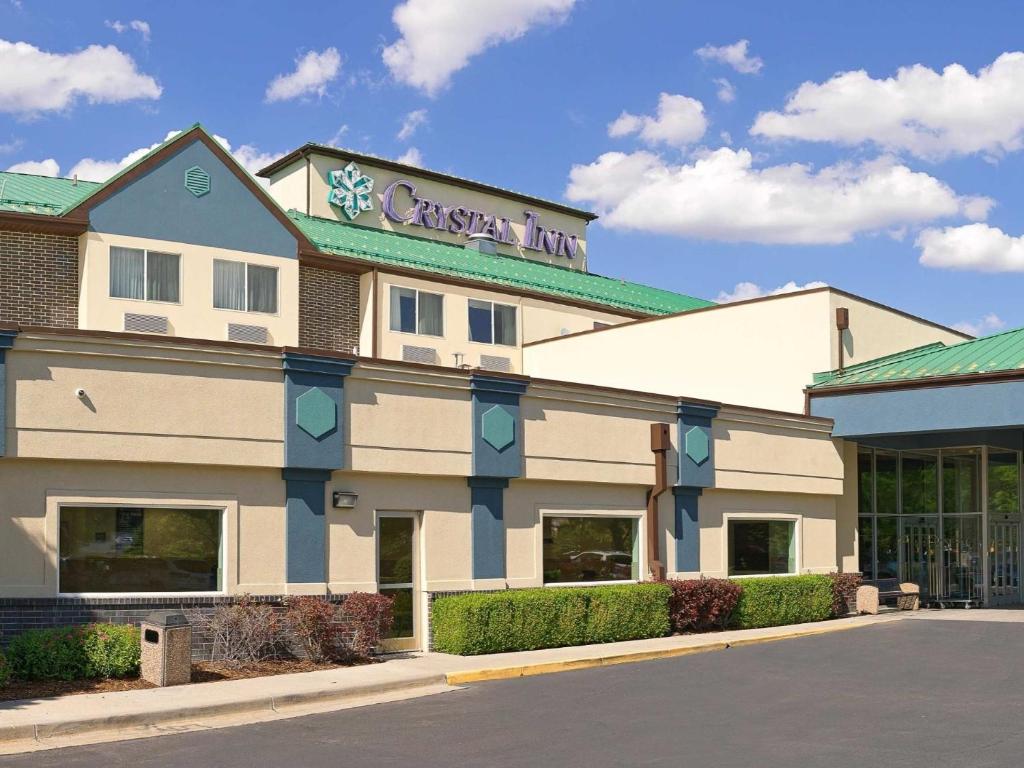 a christmas inn building on the side of a street at Crystal Inn Hotel & Suites - West Valley City in West Valley City