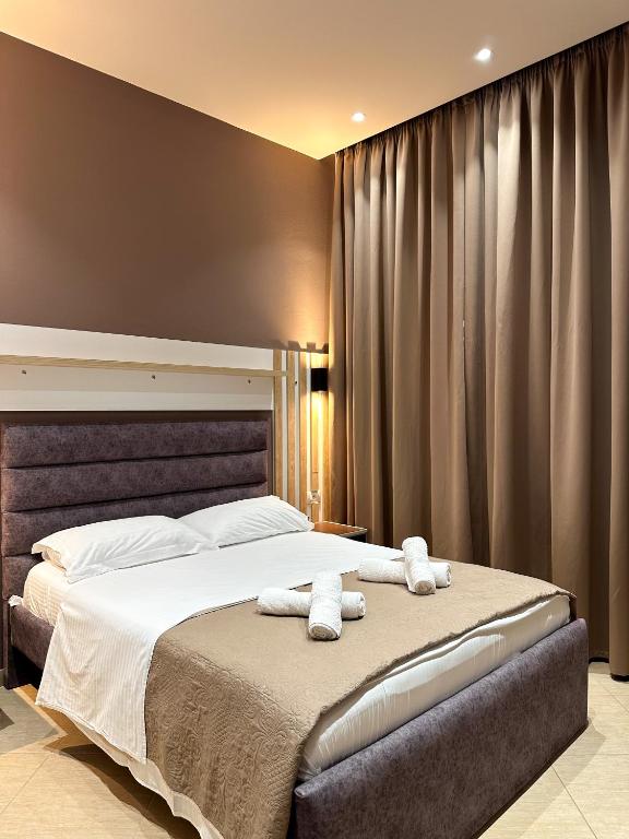 Postel nebo postele na pokoji v ubytování Hotel Meta Ksamil