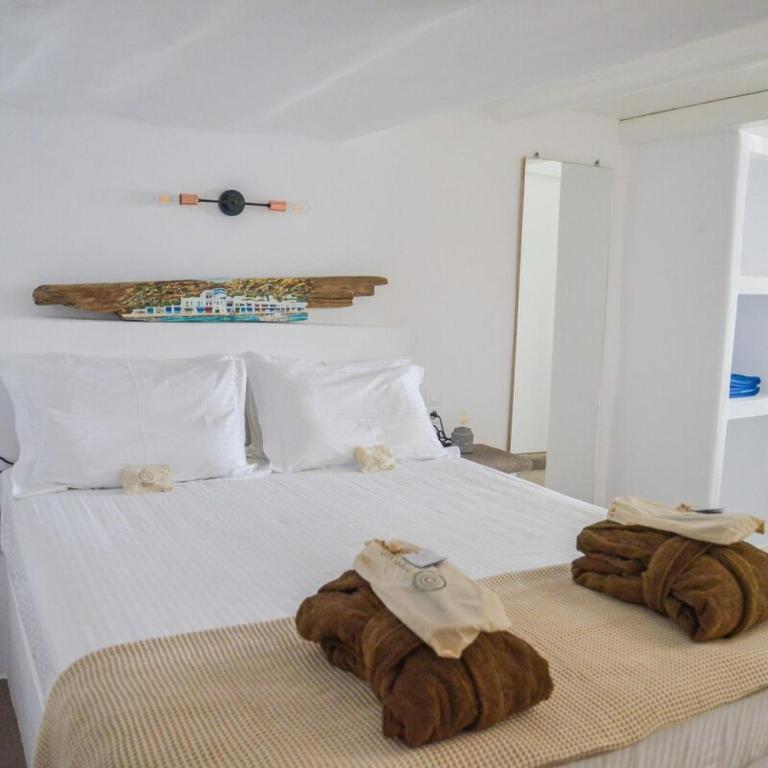 Postel nebo postele na pokoji v ubytování honeymoon klima suite