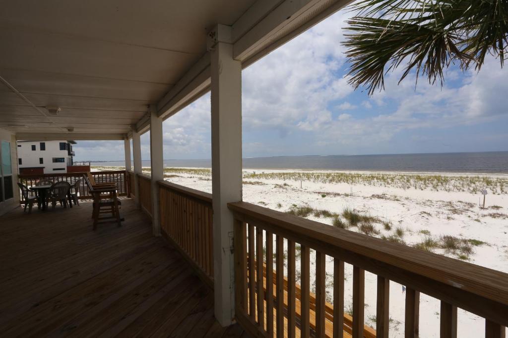 a porch of a house with a view of the beach at One More Time Again by Pristine Properties Vacation Rentals in Mexico Beach