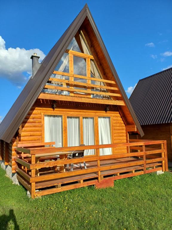 a cabin with a large window on the side of it at Villa Wood Borje in Žabljak