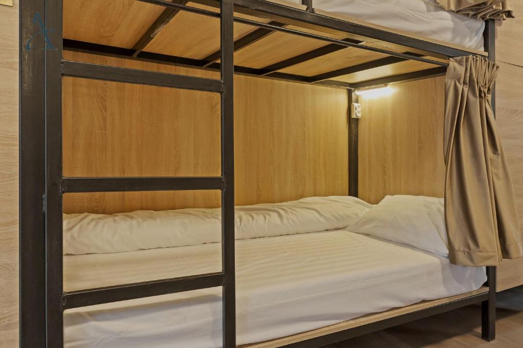 Postel nebo postele na pokoji v ubytování Ramana Garden Hostel - Self-Service Accommodation